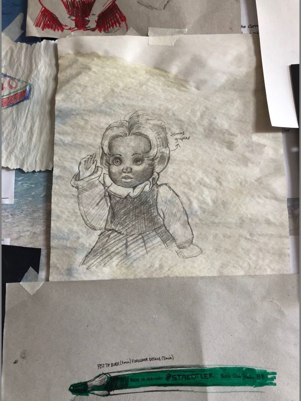 doll and pencil